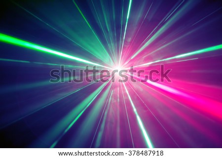 Abstract background. Light burst from laser at the party