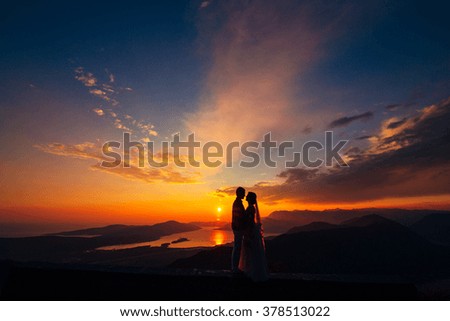 Silhouettes at sunset on Mount Lovcen