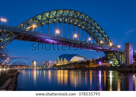Tyne Bridge at night / The iconic bridges over the River Tyne between Newcastle and Gateshead have become famous and attract many visitors to the quayside Royalty-Free Stock Photo #378535795