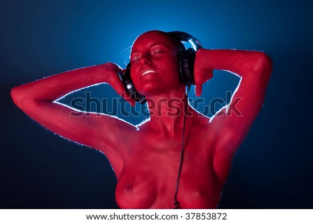 Girl in headphones. High textured skin.