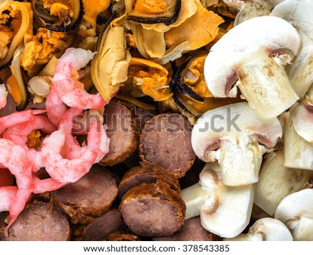 shrimp, mussels, mushrooms, salami close-up. background ingredients for pizza.