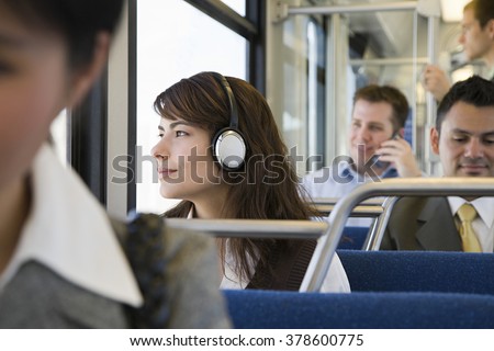 Commuters on train Royalty-Free Stock Photo #378600775