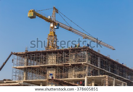 The workers are building a building.