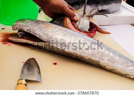 Raw fresh fish fillet  on chopping board .