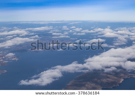 Blue sky with clouds and mountains background, aerial photography
