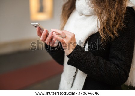 girl holding phone in his hand