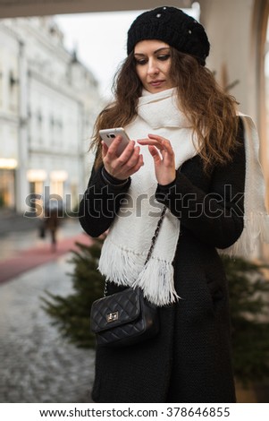 girl holding phone in his hand