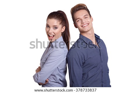 Successful business couple is standing in studio