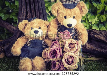 couple teddy bears with rose in the garden,  two teddy bear picnic in garden love concept vintage style