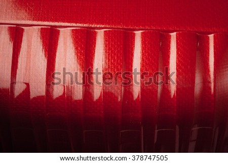 red shell carbon fiber background, closeup view