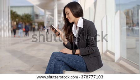 Pretty woman reading a text message on mobile