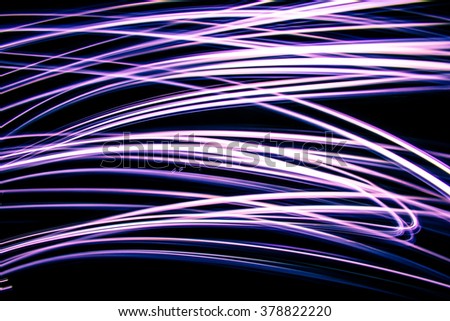 Purple Horizontal Zig Zags the Artists Stroke of Hand across Neon Background Black Background Long Exposure LED Lighting Texture Artistic Abstract Colorful Artful timelapse photography 