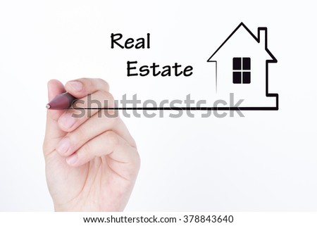 Hand drawing a house with word REAL ESTATE , financial and real estate concept