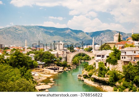 Beautiful view on Mostar city with old bridge, mosque and ancient buildings on Neretva river in Bosnia and Herzegovina Royalty-Free Stock Photo #378856822