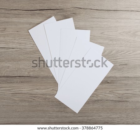 Blank flyer over wooden background to replace your design
