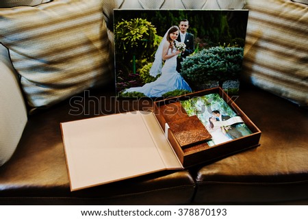 Brown leather wedding book and album with big picture on canvas