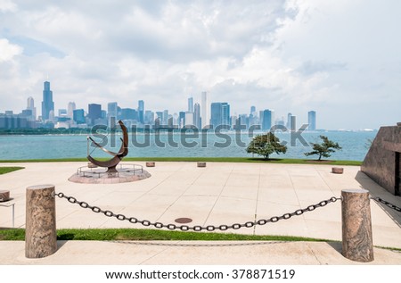 Chicago skyline and Sundial sculpture,  is named is Man Enters the Cosmos, located on the plaza of Adler Planetarium, Chicago, Illinois USA.