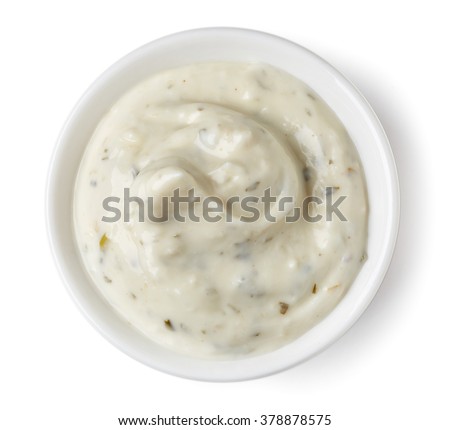 Garlic or cucumber dip sauce  in round dish isolated on white background, top view