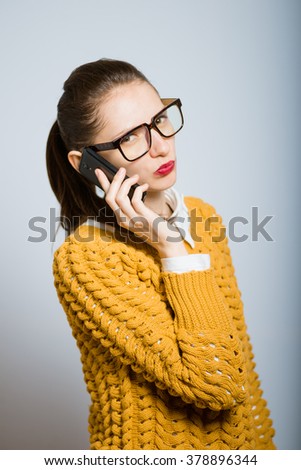 confident businesswoman talking on the mobile cell phone isolated on gray