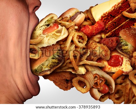 Eating junk food nutrition and dietary health problem concept as a person with a big wide open mouth feasting on an excessive huge group of unhealthy fast food and snacks. Royalty-Free Stock Photo #378935893