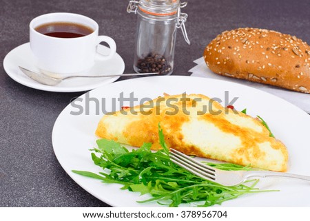 Healthy and Diet Food: Scrambled Eggs with Sausage and Vegetables. Studio Photo