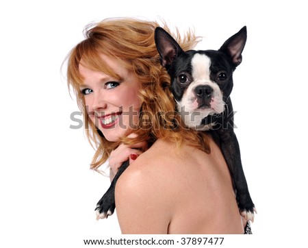 Young woman smiling with Boston Terrier on shoulder isolated over white white background