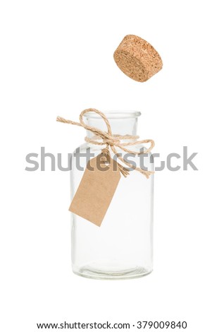 Cork pop out from bottle with label. Isolated on white.