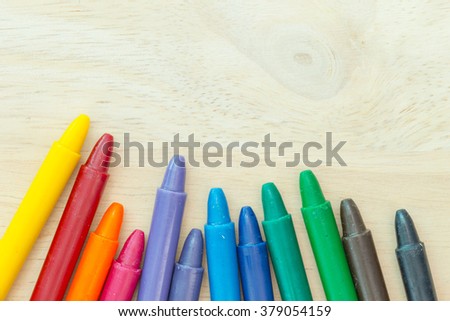 Crayon on wood background