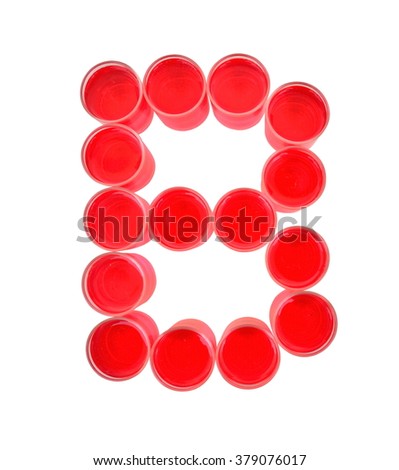 One letter of the alphabet. red drink in a glass