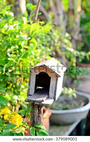 vintage wooden mail box in the garden -- vertical view