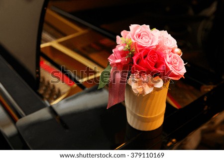 A piano and rose