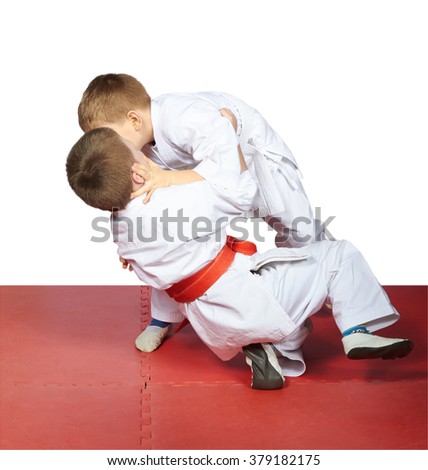 Two young athletes train judo sparring