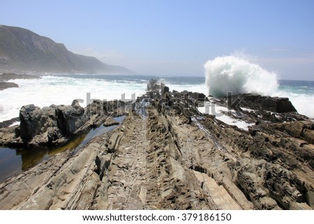 Beautiful colorful rocky coastline of South Africa, ocean view over rocks near Betty's Bay, outdoors