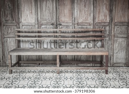 Grunge wooden chair with wall background