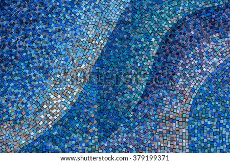 Detail of a beautiful old crumbling abstract ceramic mosaic decoration was destroyed building. Venetian mosaic as a decorative background. Selective focus Royalty-Free Stock Photo #379199371