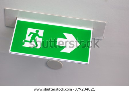green exit sign in the building.