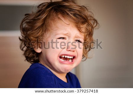 A Crying Little Baby Boy Royalty-Free Stock Photo #379257418