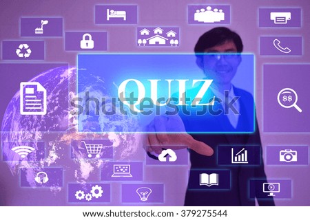 QUIZ concept  presented by  businessman touching on  virtual  screen ,image element furnished by NASA