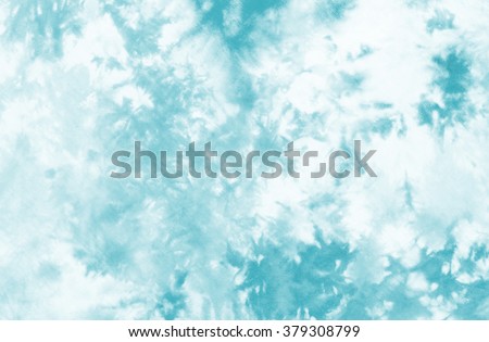 tie dyed pattern on cotton fabric background.
 Royalty-Free Stock Photo #379308799