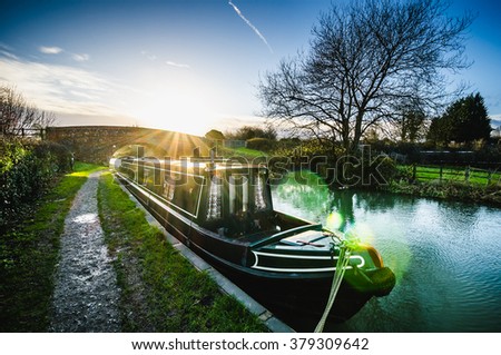 Winter sunset over the Kennet and Avon canal. Royalty-Free Stock Photo #379309642