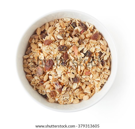 Bowl of muesli isolated on white background, top view Royalty-Free Stock Photo #379313605