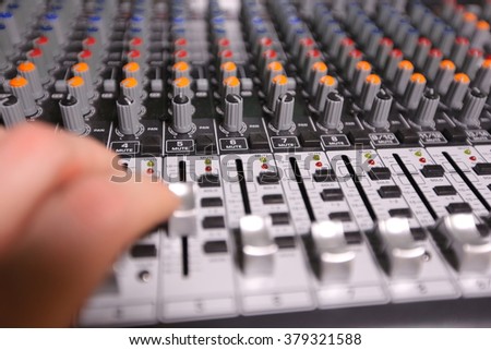 TV editor working with video and audio  mixer
