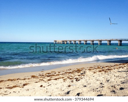 Miami Beach pier stretching far into the Atlantic Ocean