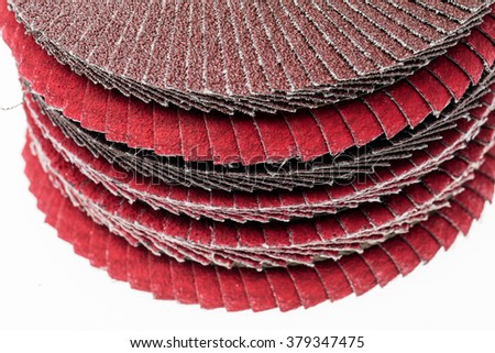 Red ant brown abrasive wheels isolated on a white background.
