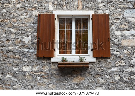 small window in the stone wall