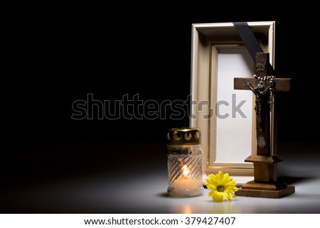natural wooden mourning frame with crucifix, flower and candle for sympathy card