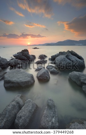 Beautiful Rock Formation with Long exposure seascape during sunset