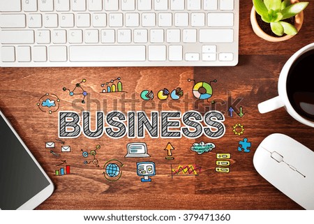 Business concept with workstation on a wooden desk 