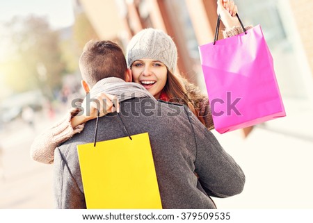 Picture of young couple shopping in the city