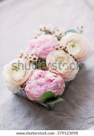composition of peonies and roses